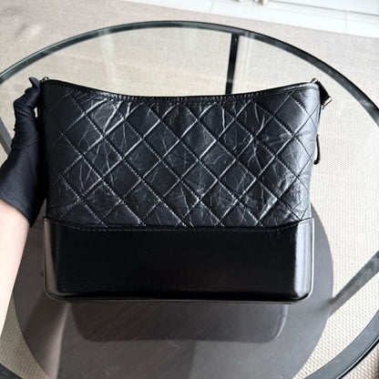 Chanel Gabrielle Medium - Quilted Aged Calfskin Black Two-tone Gold Hardware Series 25