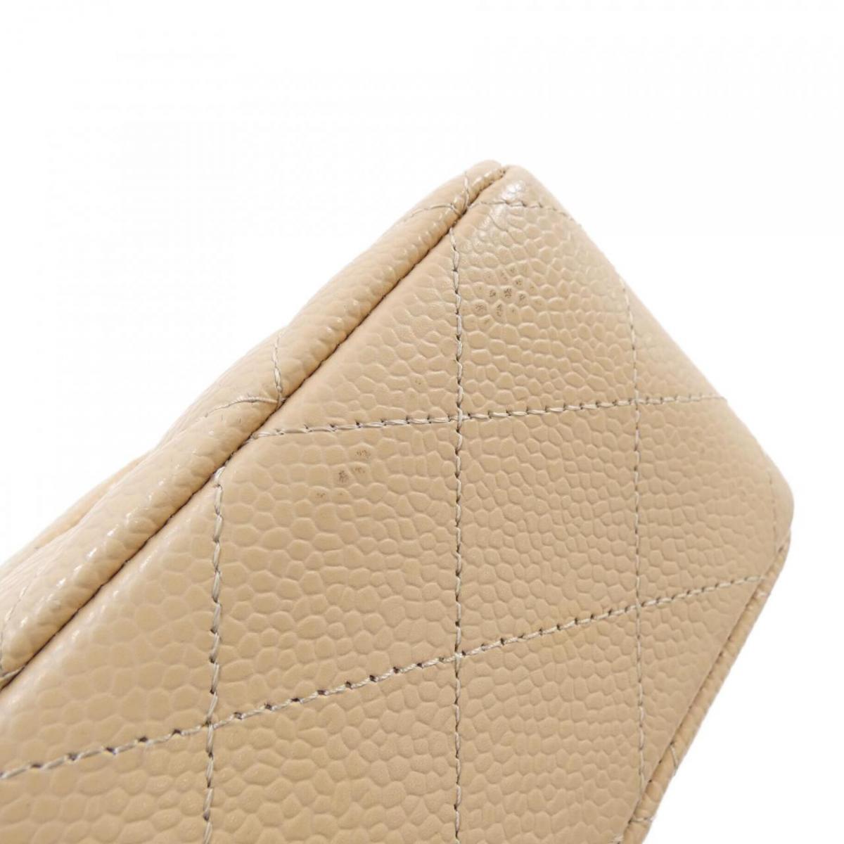 Chanel Caviar Classic beige bag
