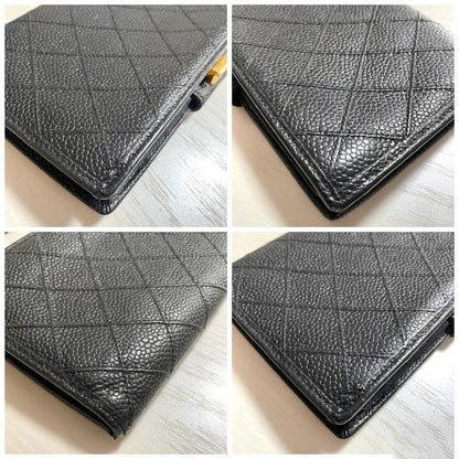 Chanel Vintage black caviar leather wallet with stitches and gold tone CC motif
