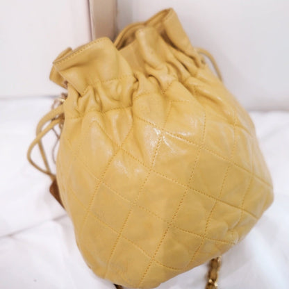 Chanel quilted drawstring chain bag