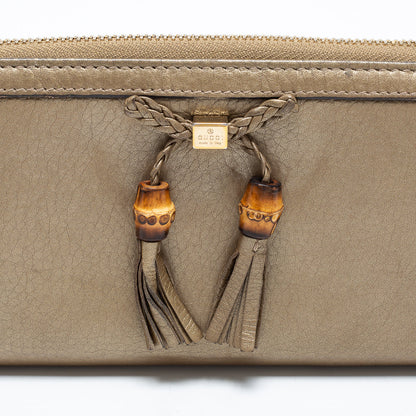 Gucci Gold Leather Bamboo Tassel Bow Zip Around Wallet