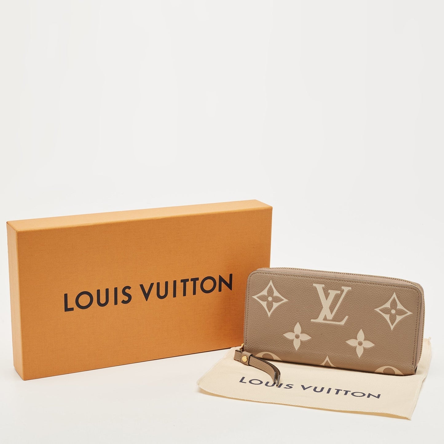 LOUIS VUITTON Tourterelle/Creme Monogram Empreinte Leather Zippy Wallet