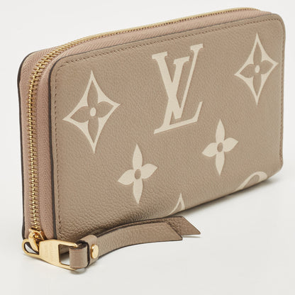 LOUIS VUITTON Tourterelle/Creme Monogram Empreinte Leather Zippy Wallet