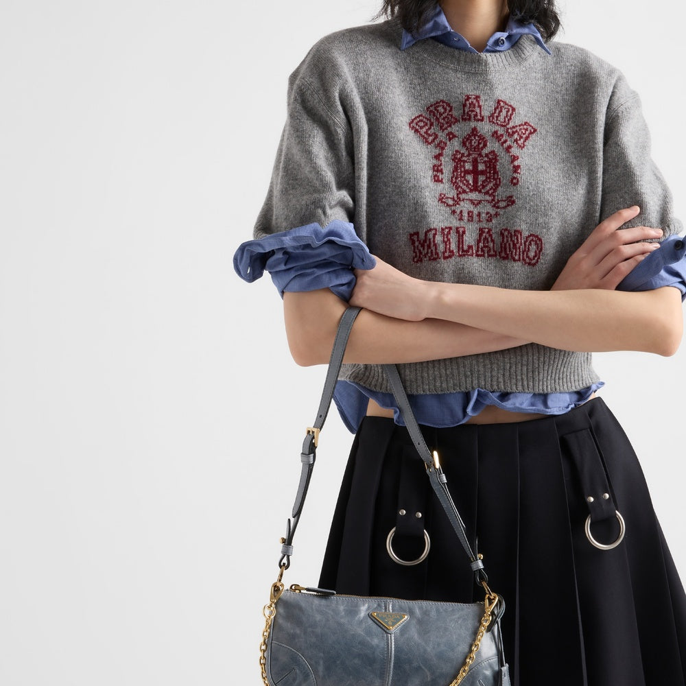 Pleated gabardine miniskirt with metal rings