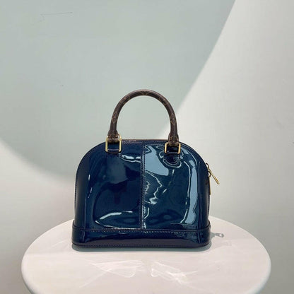 Louis Vuitton Alma Bag in Patent Navy Blue with Monogram Handles and Strap - Medium Size