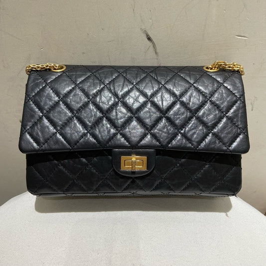 CHANEL . BLACK WRINKLE LEATHER FLAP BAG GOLD CHAIN STRAP